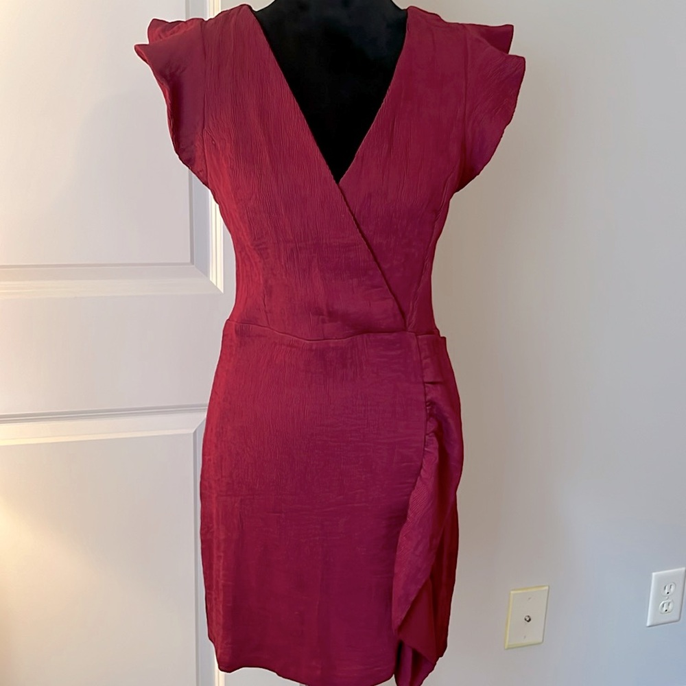 Burgundy dress with ruffle down one side